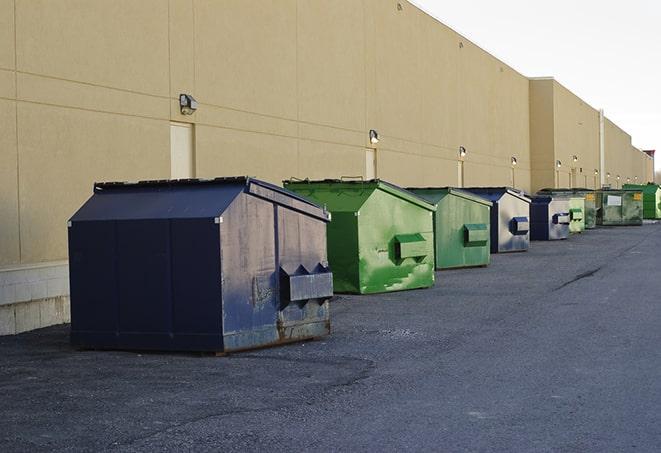 large construction waste containers in a row at a job site in Georgetown